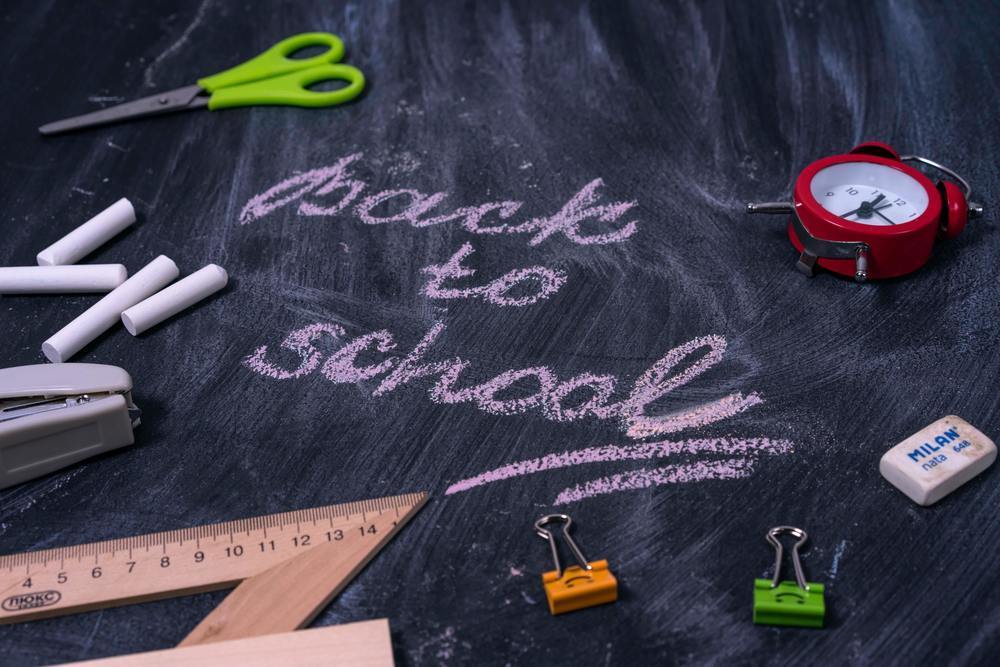 Back to school text on chalkboard